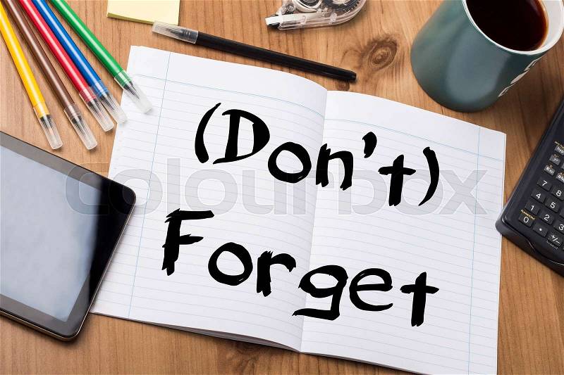 (Don’t) Forget - Note Pad With Text On Wooden Table - with office tools, stock photo