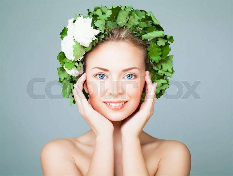 Perfect Woman Wearing Green Leaves Wreath on Blue Banner Background, stock photo