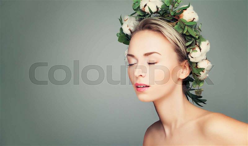 Beautiful Woman with Wreath of Organic Leaves and Cotton Flowers. Relaxation, stock photo