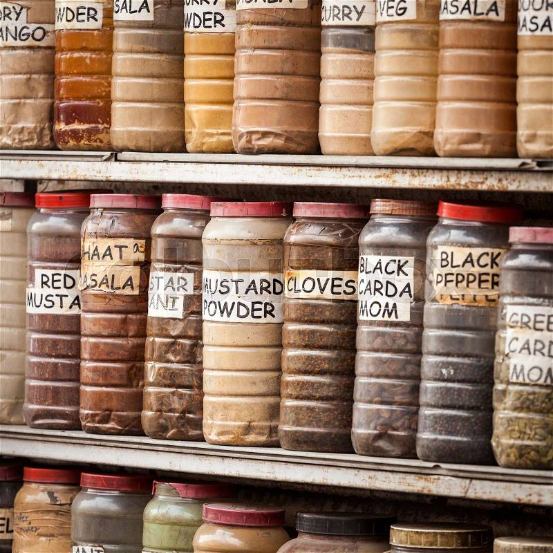 Jars of herbs and powders in a indian spice shop, stock photo
