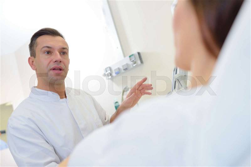 Doctor in conversation with patient, stock photo