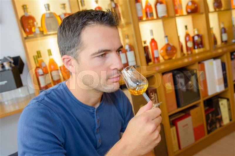 Critic smelling the wine, stock photo