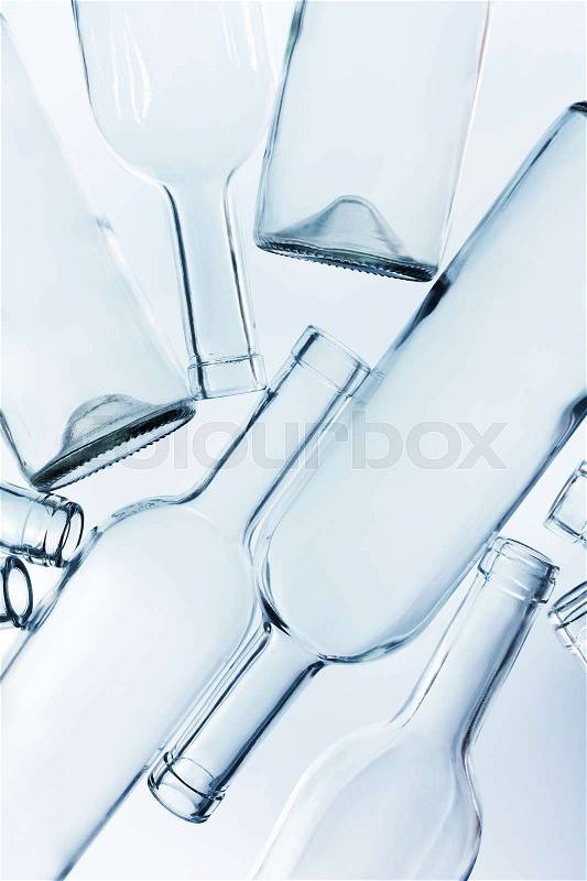A heap of empty glass wine bottles without labels, stock photo