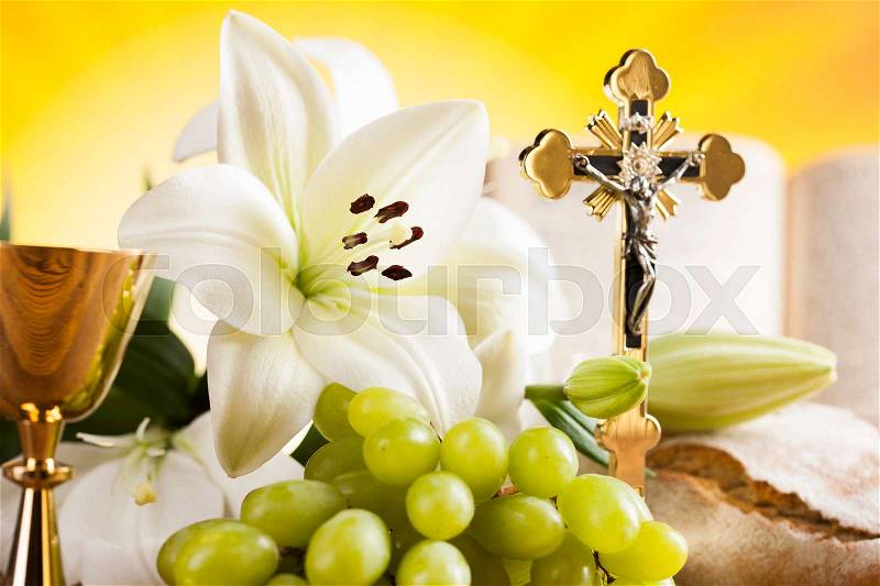 Symbol christianity religion a golden chalice with grapes and bread wafers, stock photo