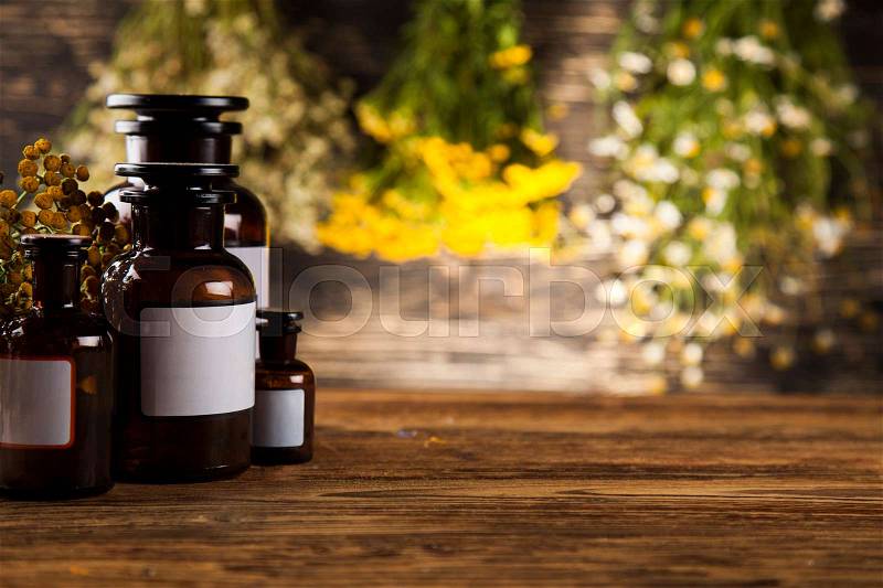 Natural medicine on wooden table background, stock photo