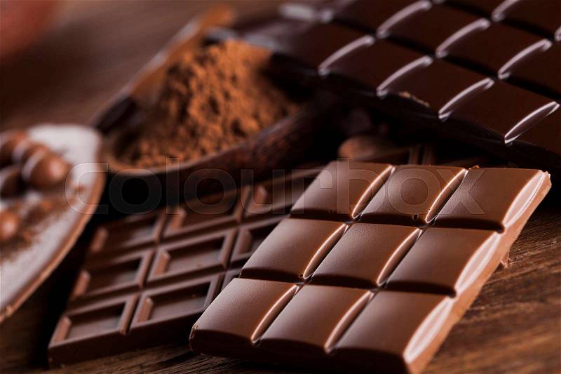 Chocolate bar, candy sweet, dessert food on wooden background, stock photo