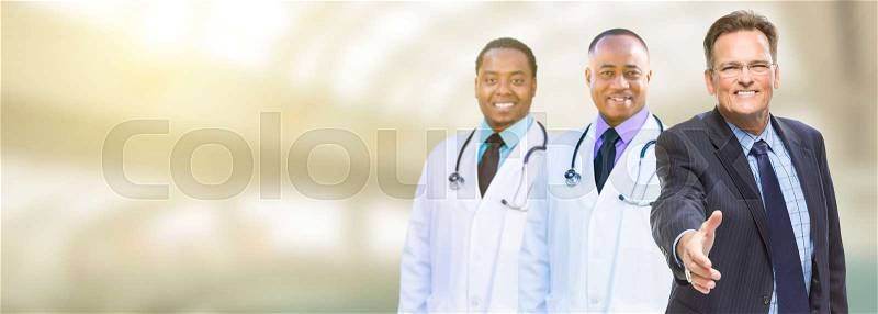 Caucasian Businessman and African American Male Doctors, Nurses or Pharmacists with Room For Text, stock photo