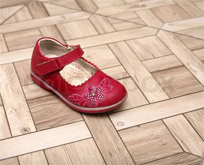 Baby\'s orthopedic shoe on the floor, stock photo
