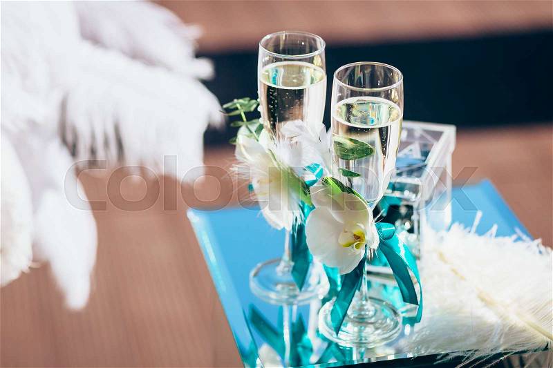 Luxury wine glasses with champagne, wedding decoration. Close-up, stock photo