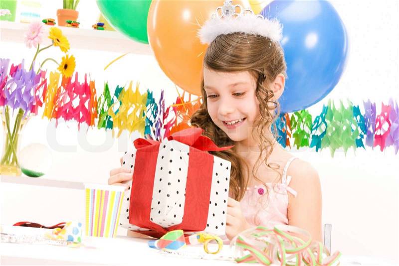 Happy party girl with balloons and gift box, stock photo