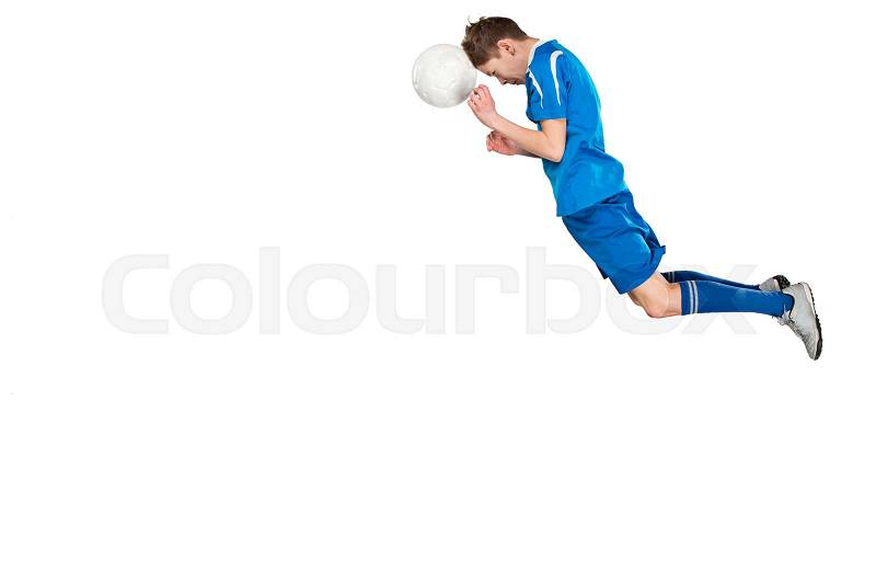 Young boy with soccer ball doing flying kick, isolated on white, stock photo