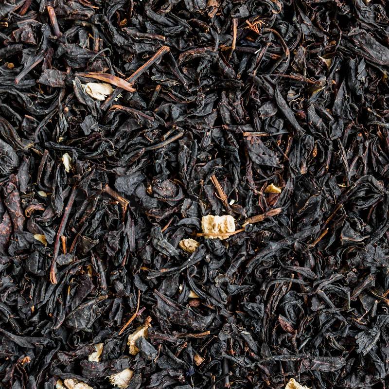 Black tea background. Heap of dry black tea, stock photo
