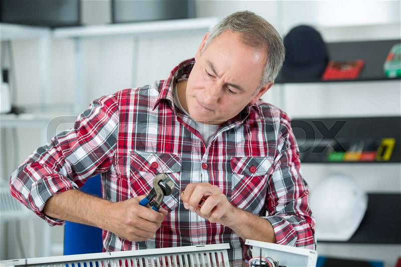 Plumber man with tools, stock photo