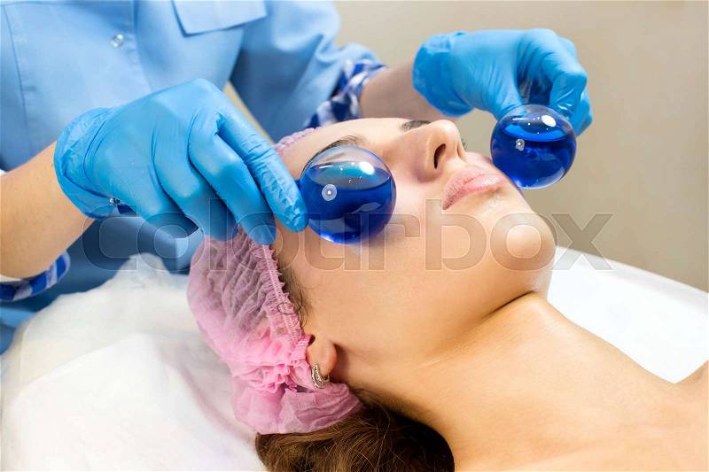 Process cosmetic mask of massage and facials in beauty salon, stock photo