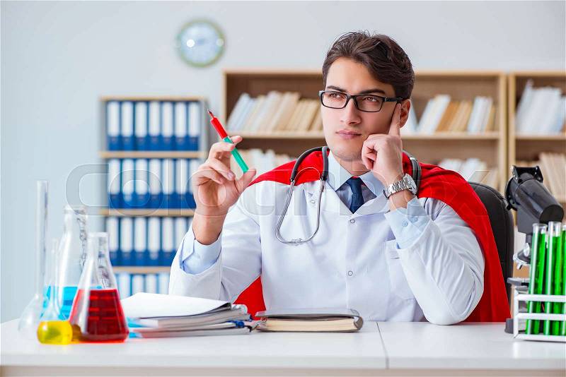 Superhero doctor working in the hospital lab, stock photo