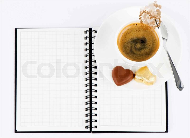 Cup of hot coffee and open note book on white background, stock photo