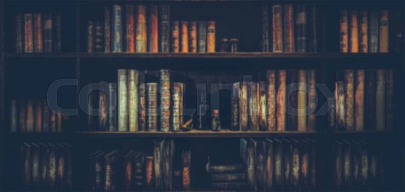 Blurred background . The background is a large bookshelf or book case on the wall, stock photo