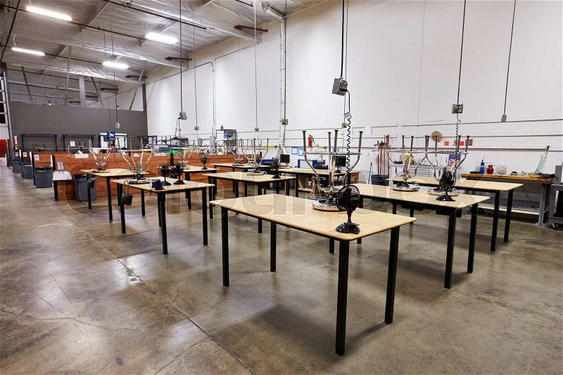Interior Of Factory With Empty Work Benches, stock photo
