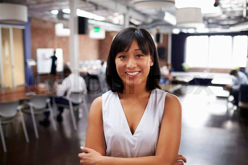 Portrait Of Businesswoman In Modern Open Plan Office, stock photo