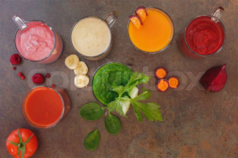 Freshly prepared fruit and vegetable smoothies. Top view, blank space, rustic surface, stock photo