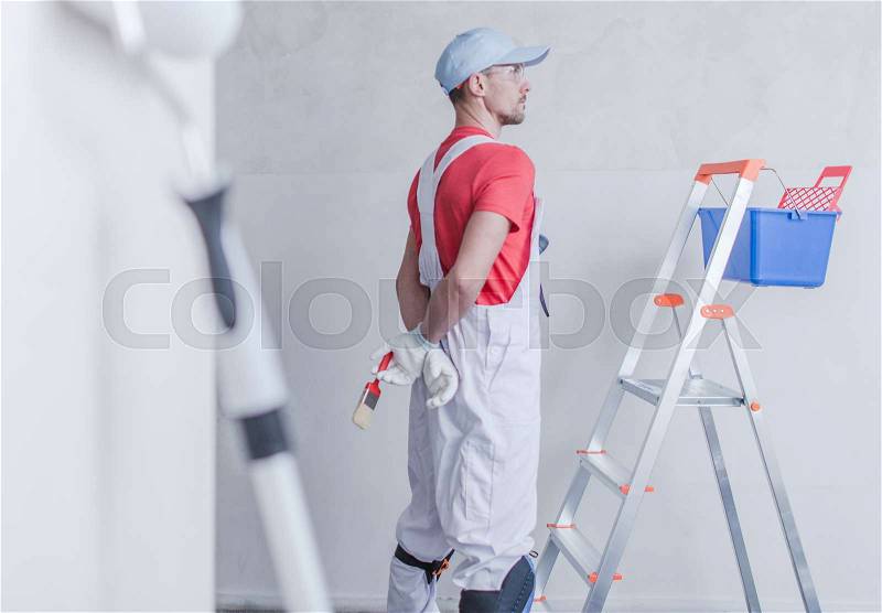 Room Painter and His Job. Apartment Remodeling Concept, stock photo