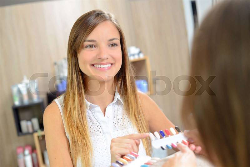 Getting her nails done, stock photo