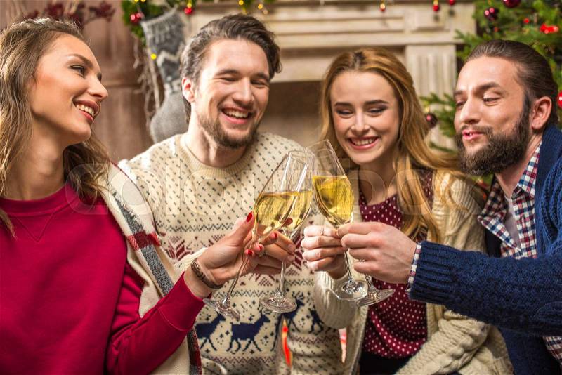 Group of happy young people with glasses of champagne , stock photo