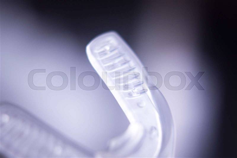 Dental braces aligners accelerator for both modern invisible and metal brackets to straighten and align teeth, stock photo