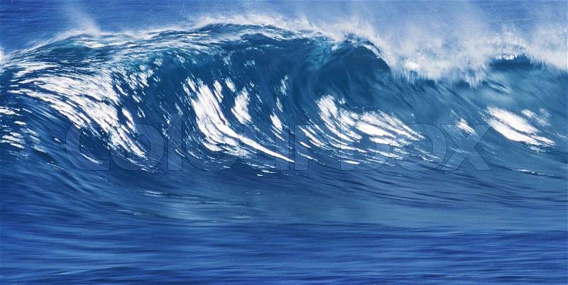 Big Blue Surfing Wave Breaks in Ocean, stock photo