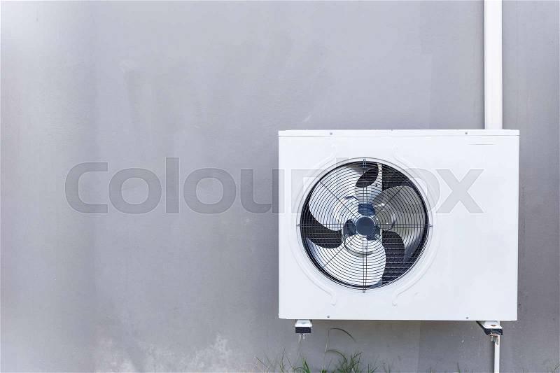 Outdoor air conditioning compressor installed the wall, stock photo