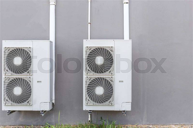 Outdoor air conditioning compressor installed the wall, stock photo