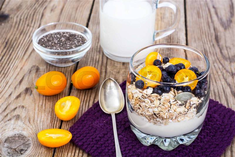 Dietary and fitness food-oat flakes with blueberries and milk. Studio Photo, stock photo