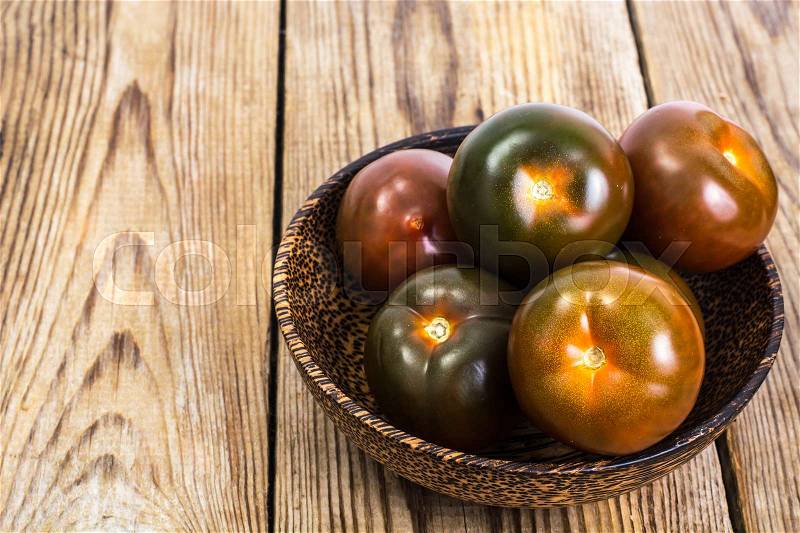 Black tomatoes Kumata. Studio Photo, stock photo