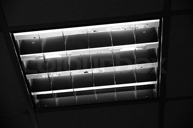 Built-in office ceiling light, close up black and white photo, stock photo