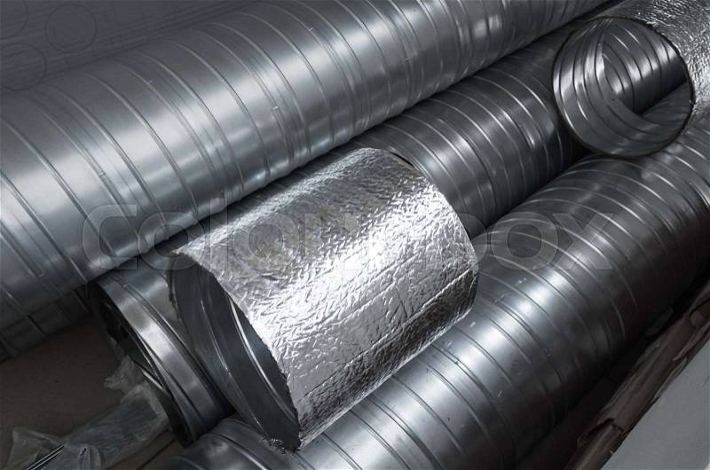 Group of shiny metallic tubes for air ventilation systems, stock photo