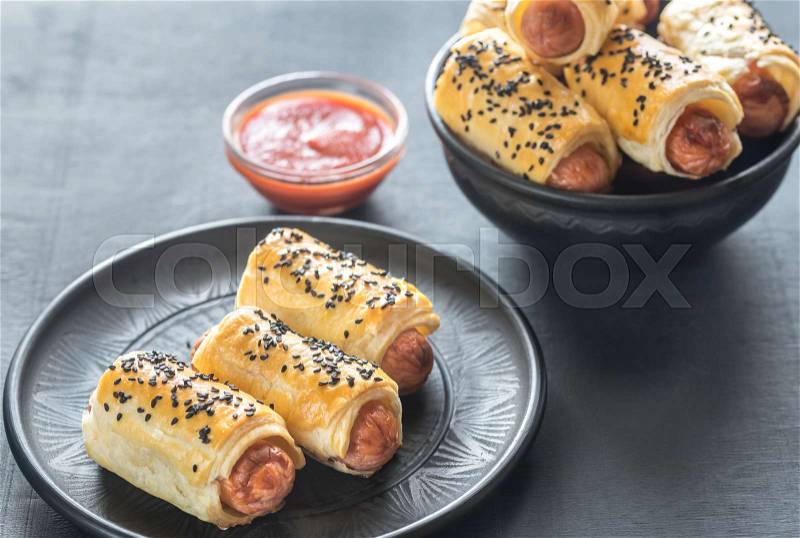 Portion of sausage rolls, stock photo
