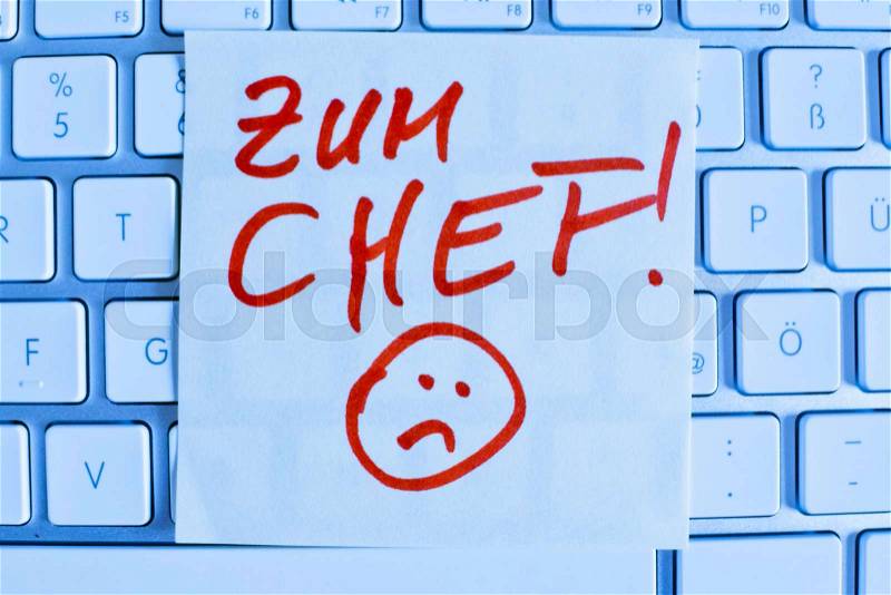 A memo is on the keyboard of a computer as a reminder: for chef, stock photo
