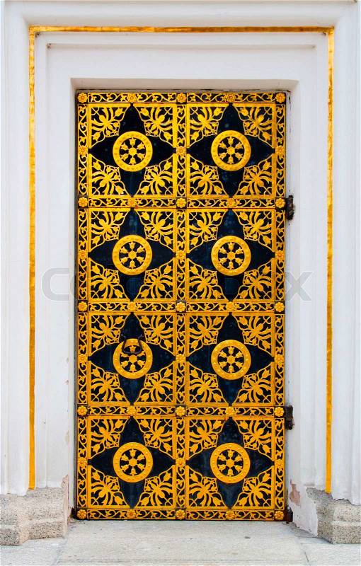 Ornamented gold door Golden decoration of the door to Cathedral of the Dormition in Kiev Pechersk Lavra - famous monastery inscribed on UNESCO world heritage list, stock photo