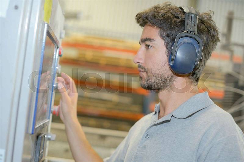 Man with ear protection, stock photo