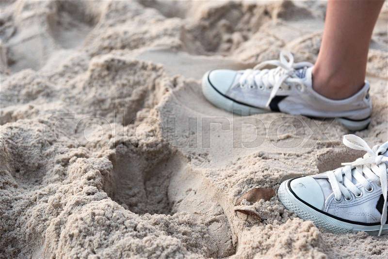 Shoes on tropical sand beach texture background with copy space , stock photo