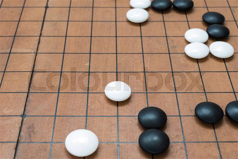 Go game board. Weiqi game board. Stones on a Go board, stock photo