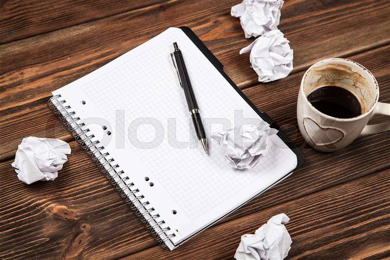 Creative block concept - blank notepad and crumpled paper, stock photo