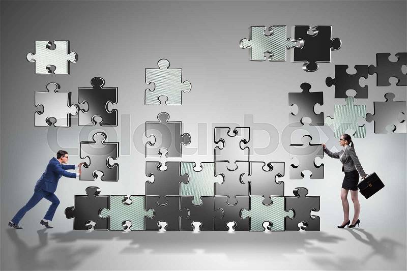 Business concept of teamwork with puzzle pieces, stock photo