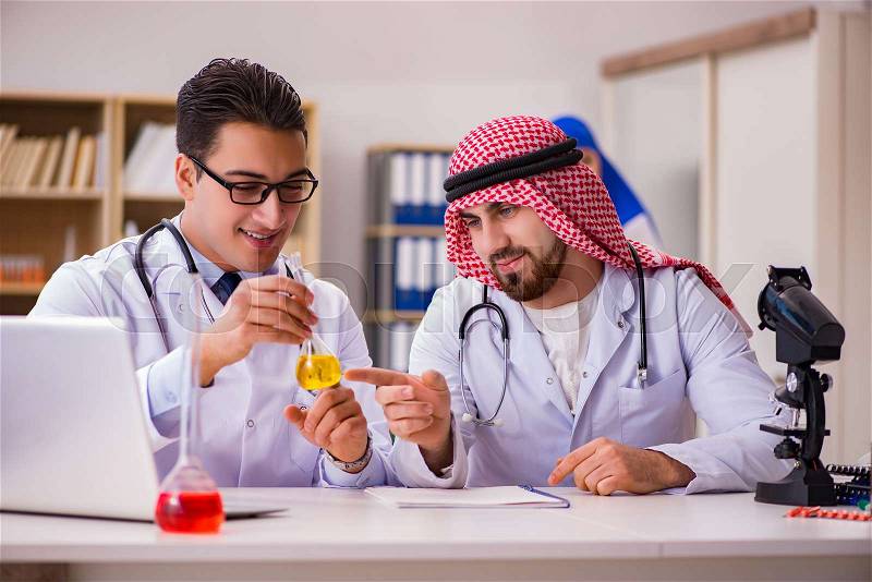 Diversity concept with doctors in hospital, stock photo