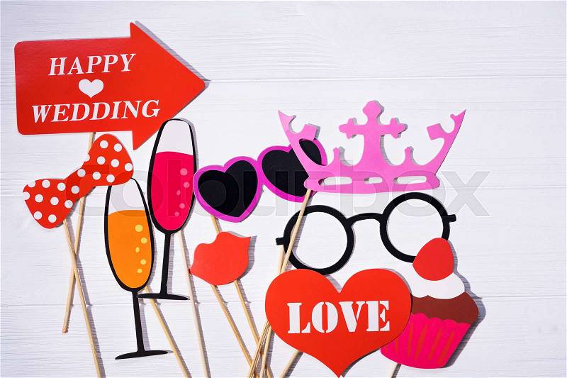 Photo booth props for wedding. funny paper faces, lips, glasses and mustache, stock photo