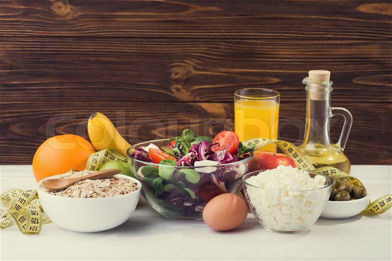 A set of products for diet and healthy nutrition with fresh vegetables, fruits and porridge, stock photo