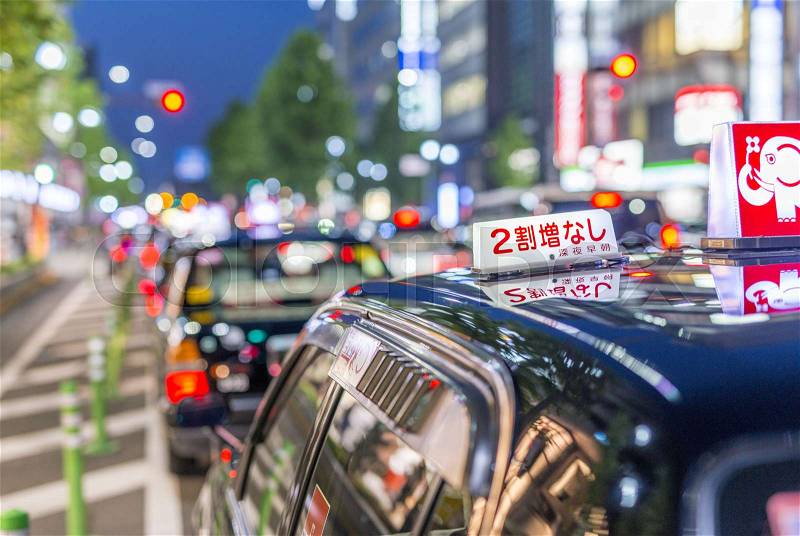 KYOTO, JAPAN - APRIL 2016: Black taxi awaits customers at night. Kyoto is a city located in the central part of the island of Honshu, Japan, stock photo