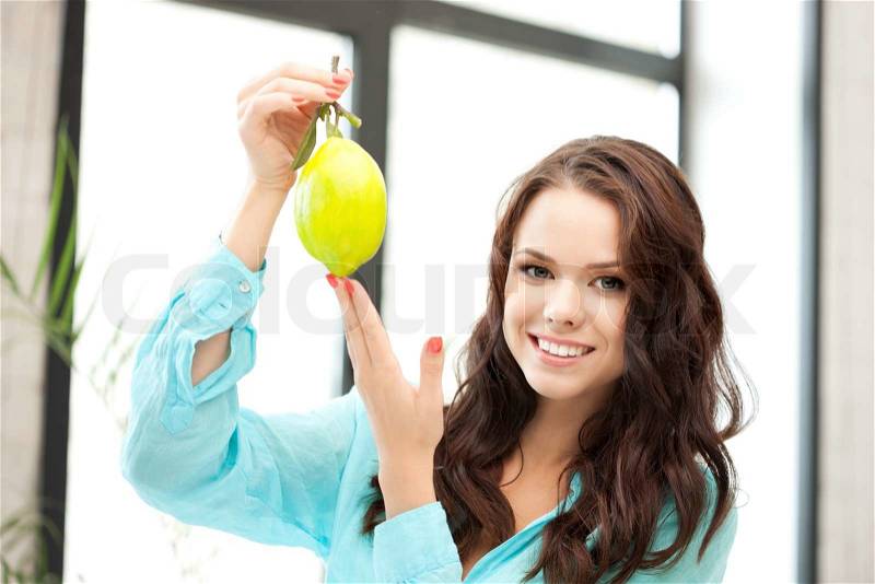 Bright picture of lovely woman with lemon, stock photo