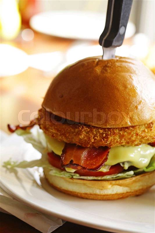 Traditional burger with beef, bacon and cheese, stock photo