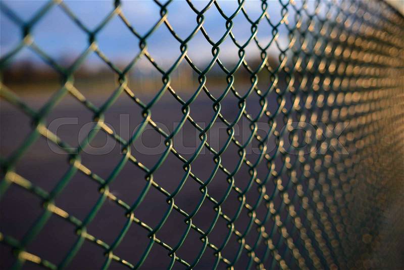 Fence with metal grid in perspective, background, stock photo